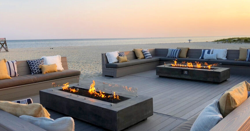 A seaside lounge with a firepit.