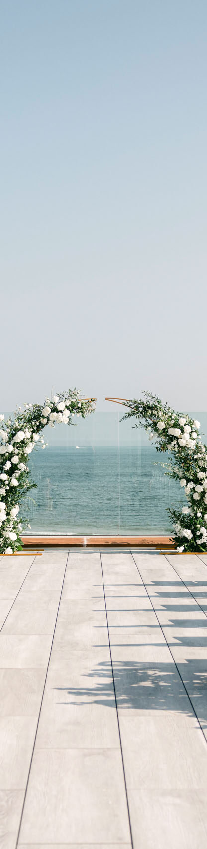 A rooftop deck set up for a wedding.