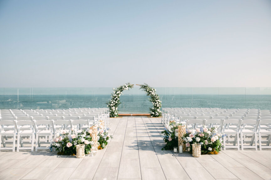 A rooftop deck set up for a wedding.